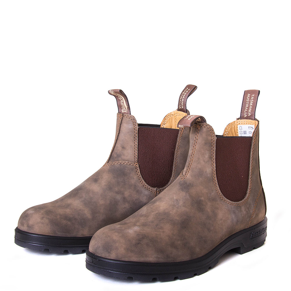 Blundstone Men's 585 Chelsea Boot in Rustic Brown. Built to last. Durable material, with comfortable shock absorption insole. Rubber sole. Front view, pair.