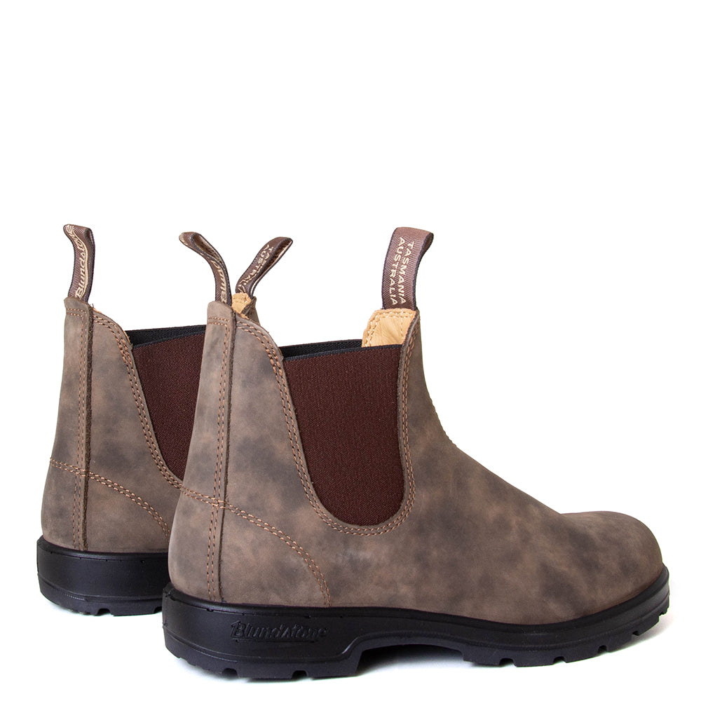 Blundstone Men's 585 Chelsea Boot in Rustic Brown. Built to last. Durable material, with comfortable shock absorption insole. Rubber sole. Back view, pair.