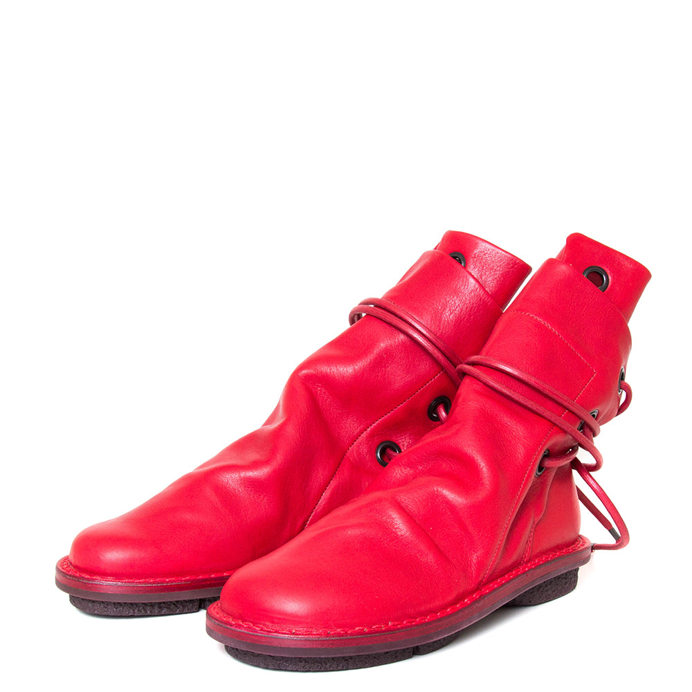 Trippen Awning. Women's leather slip-on, ankle boot in red leather, wrap-around laces. Made in Germany. 3/4 view.