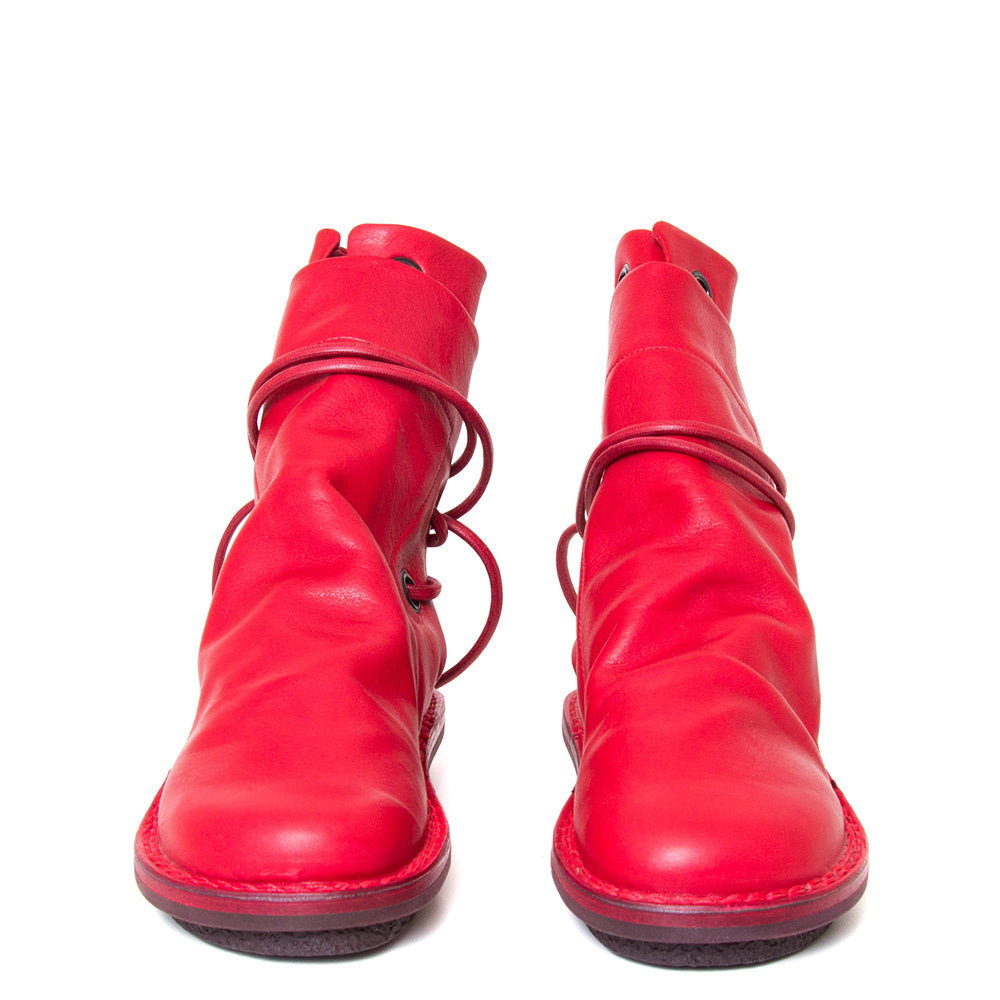 Trippen Awning. Women's leather slip-on, ankle boot in red leather, wrap-around laces. Made in Germany. Front view.