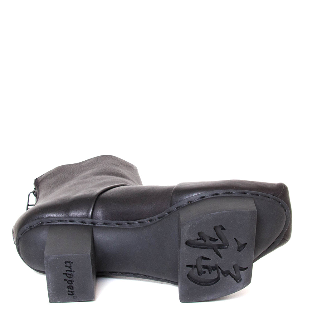 Trippen Challenge. Women's deep black leather platform ankle boot with back zipper, 3-inch rubber heel. Sole view.