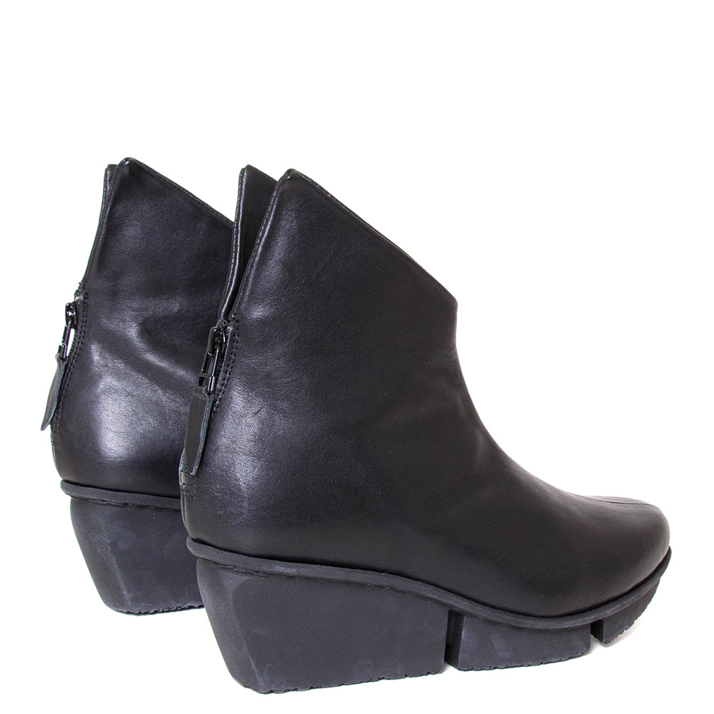 Trippen Hover. Women's platform wedge ankle boot in black leather. Made in Germany. Back view.