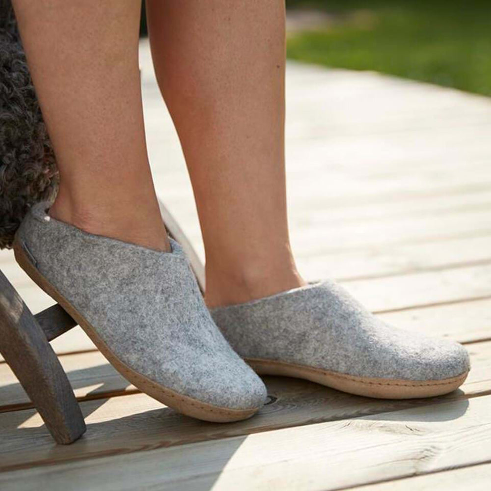 Glerups Slip On. Unisex 100% grey wool slipper. Made in Romania. Model view.