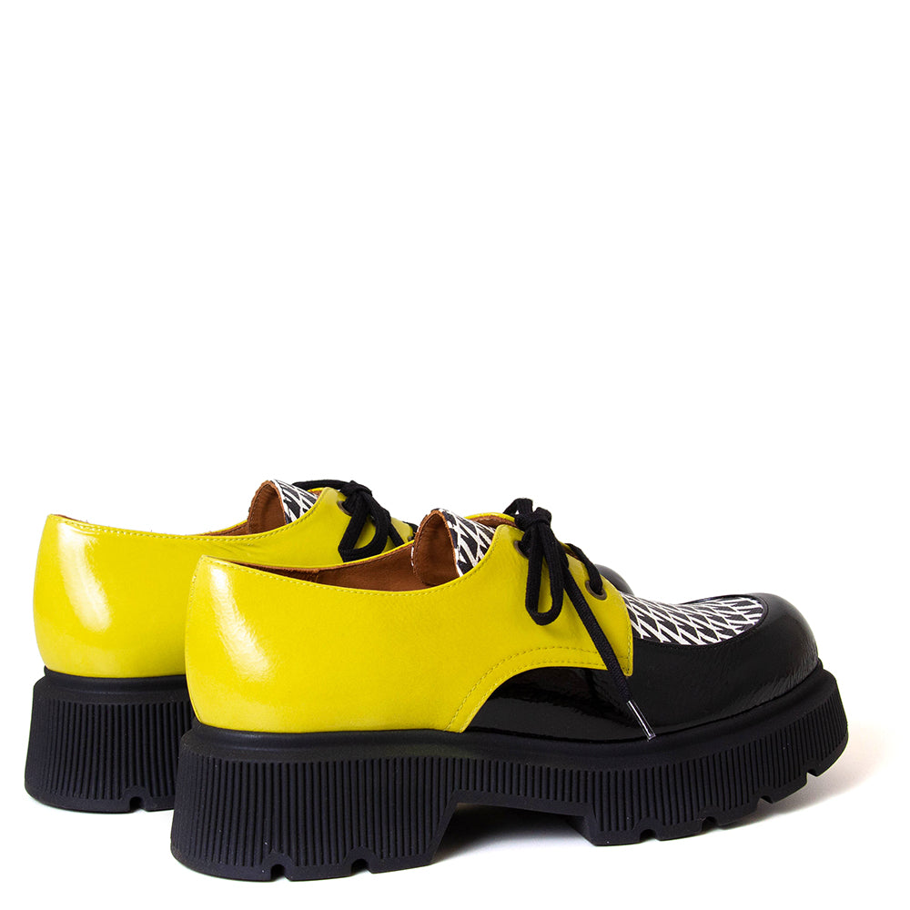 Chie Mihara Qamba. Women's platfom yellow, black and white leather. Made in Spain.