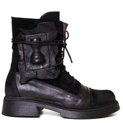 Papucei Geo. Women's black leather combat 1⅝ inch ankle boot. Side view.