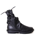 Trippen Resistor. Women's flat sole black leather ankle boot.