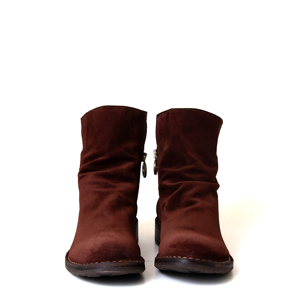 Pair of brown suede boots on a white background