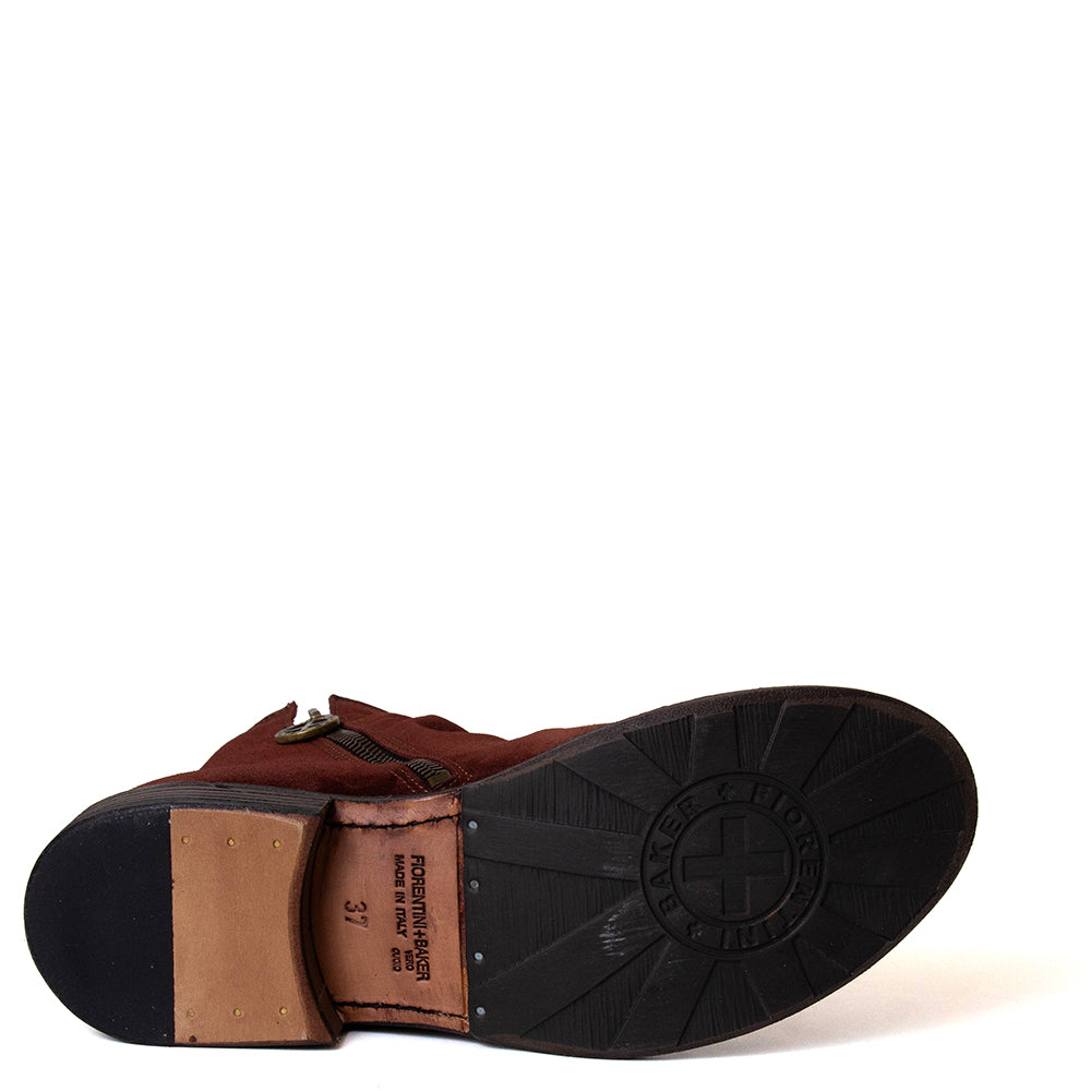 Close-up of a brown leather shoe sole with visible brand logo on a white background