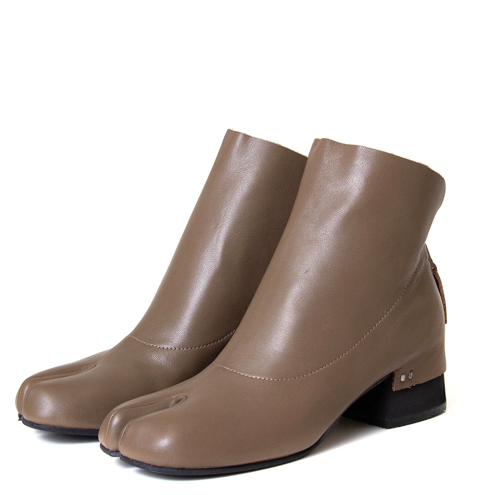 yuko imanishi + 737038-1 Haku. Women's 1¾" heel split toe leather ankle boot. 