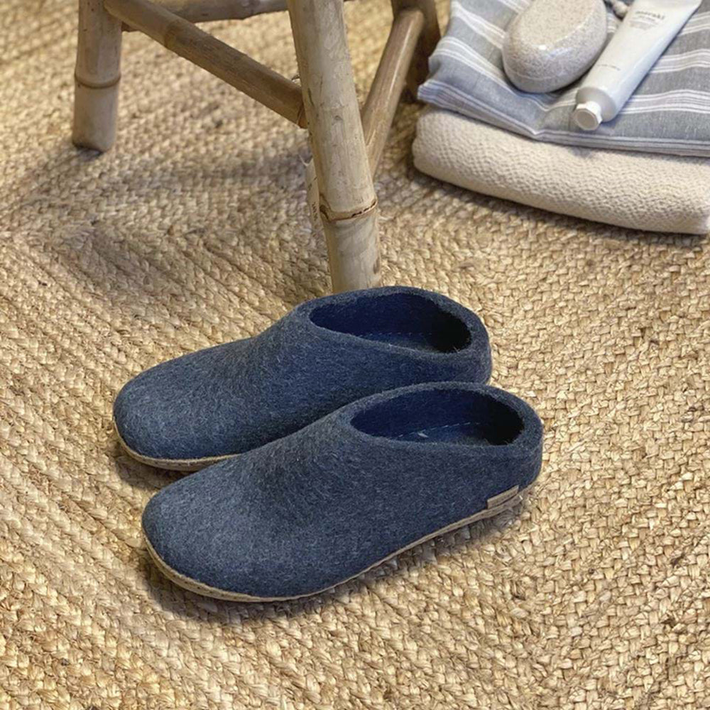 Glerups Slip On. Unisex 100% denim wool slipper. Made in Romania. Shoe on carpet view.
