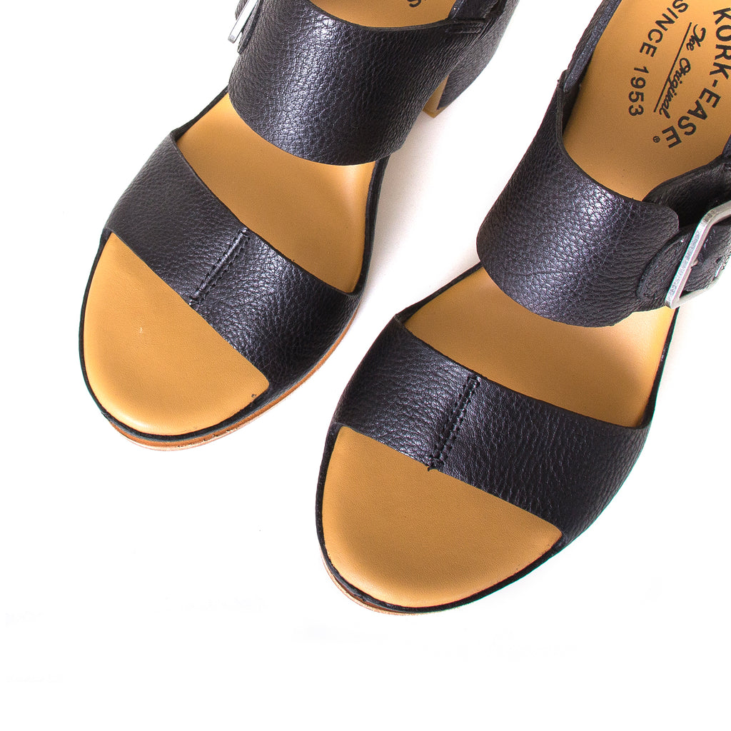 Kork-Ease San Carlos. Women's leather sandals in Black. Side buckle, cushioned leather footbed, and a 3 ½ inch platform, 2.5 inch heel. Top view, pair.