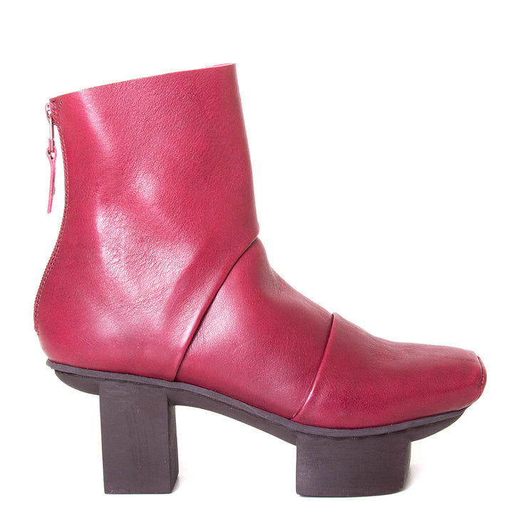 Trippen Challenge. Women's deep red leather platform ankle boot with back zipper, 3-inch rubber heel. Side view.