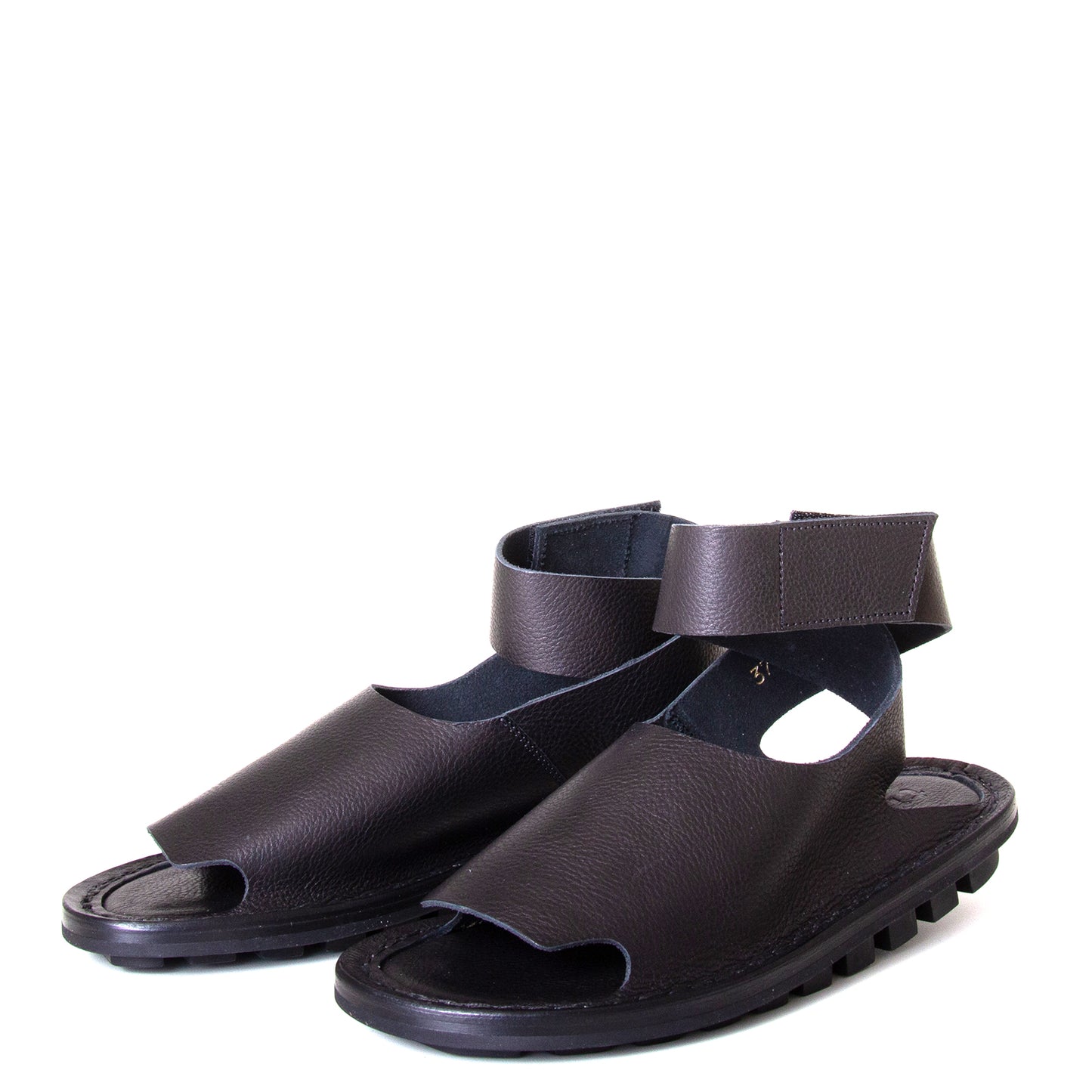 Trippen Hug. Women's sandal in Black leather, rubber sole, ankle strap with velcro for a secure fit. Made in Germany. Front view, pair.