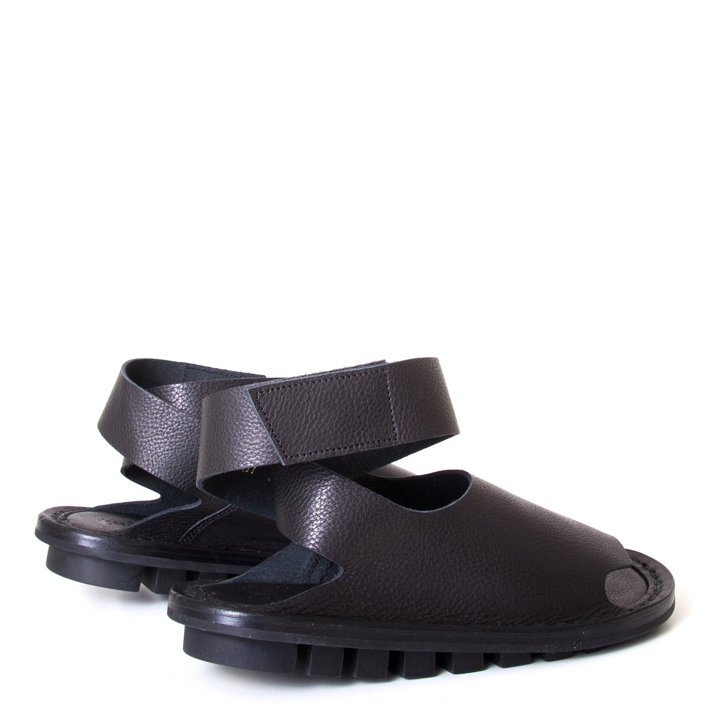 Trippen Hug. Women's sandal in Black leather, rubber sole, ankle strap with velcro for a secure fit. Made in Germany. Back view, pair.