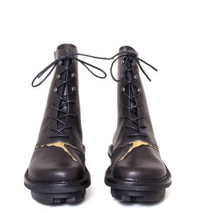 Trippen Kintsugi. Women's platform combat ankle boot in black leather. Made in Germany. Front view.