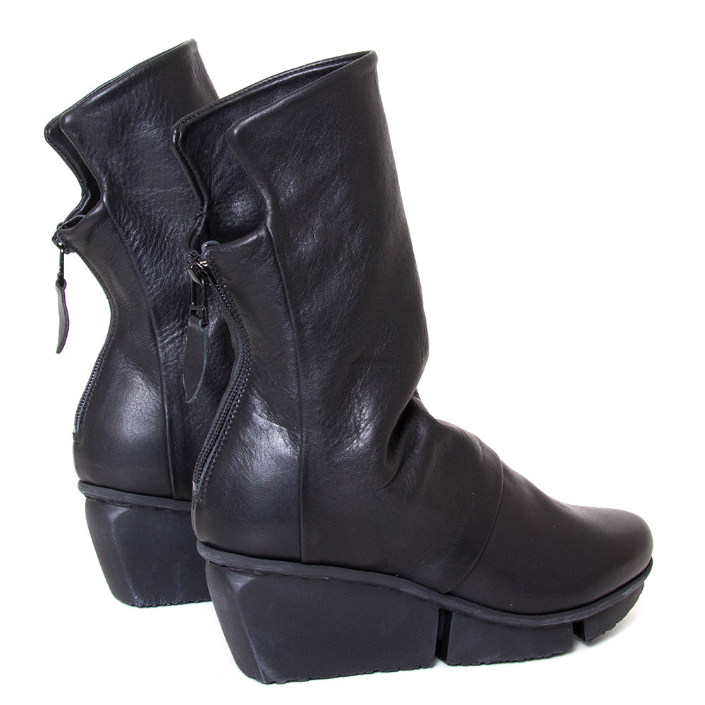 Trippen Mellow. Women's platform wedge ankle boot in black leather. Made in Germany. Back view.