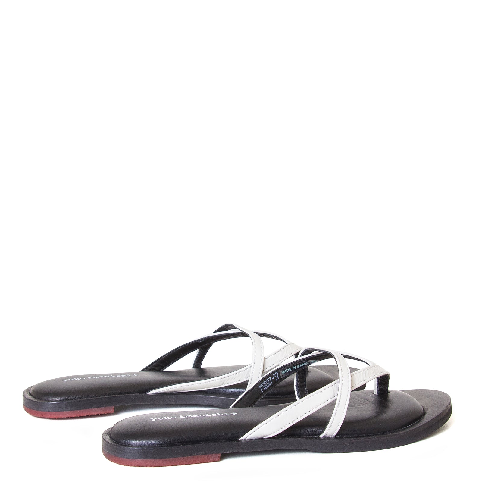 yuko imanishi + Alina. Women's sandals in Off-White patent leather, memory foam footbed for comfort. Flat heel. Back view, pair.